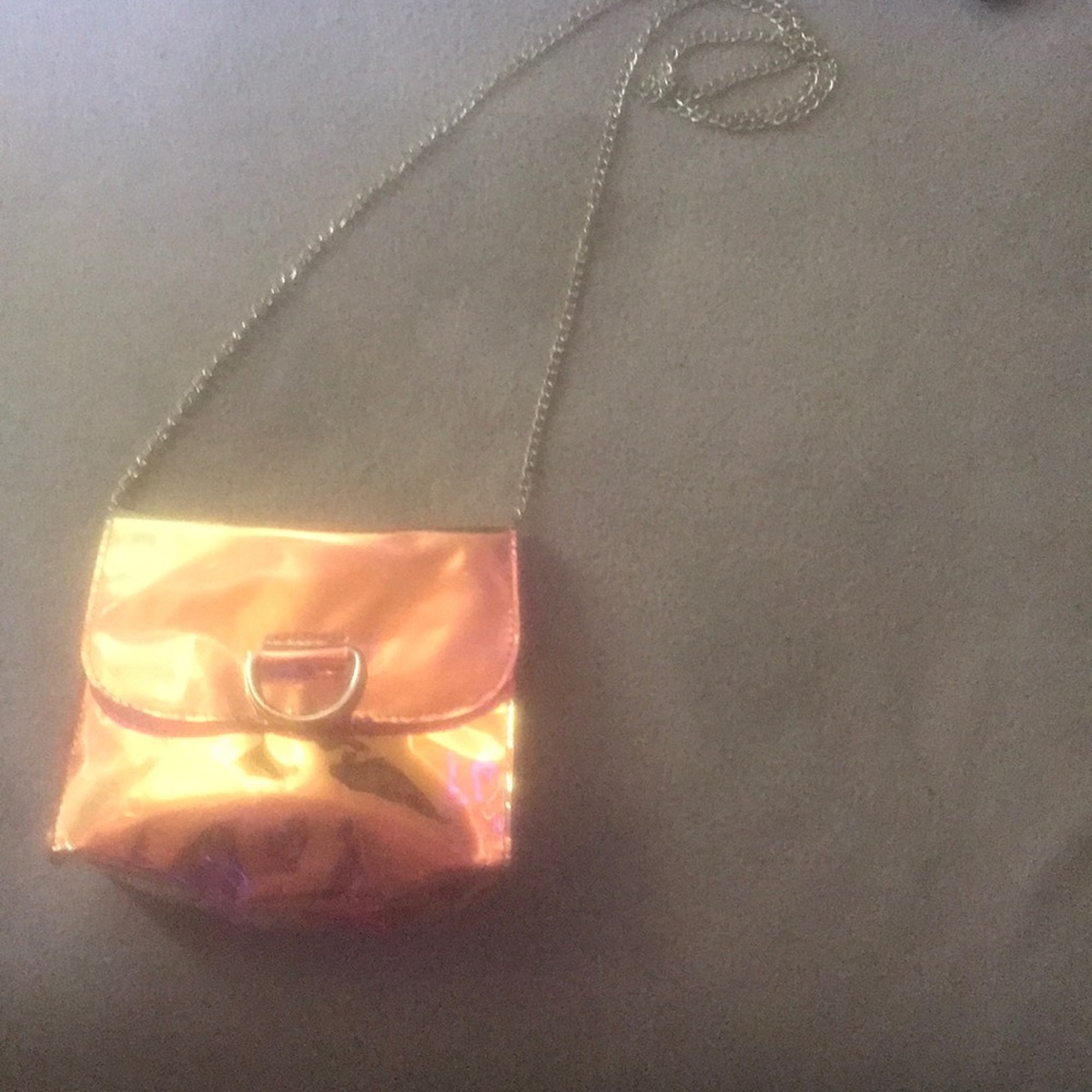 A crossbody holographic purse